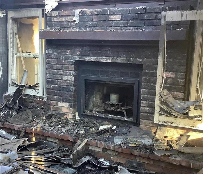 burned house, blackened walls, fire place