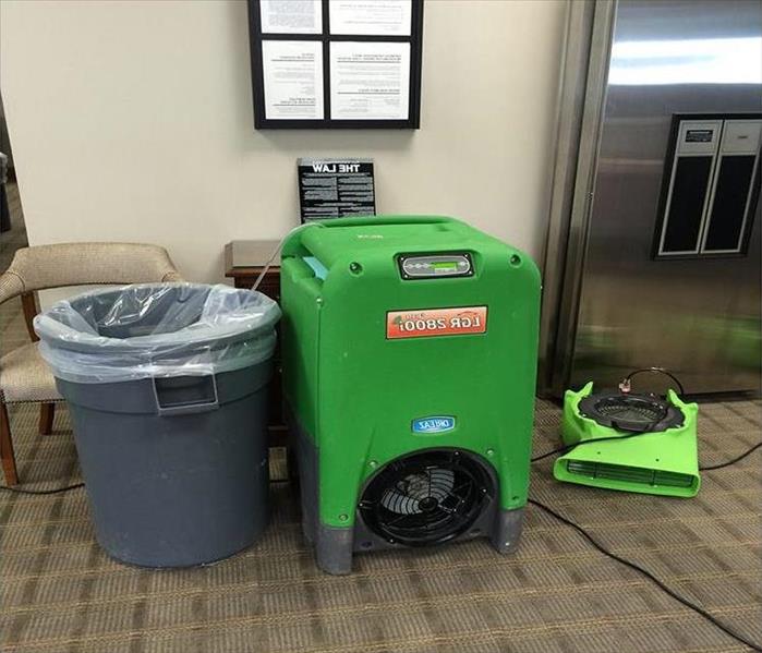 trash container, LGR dehu and air mover in foreground