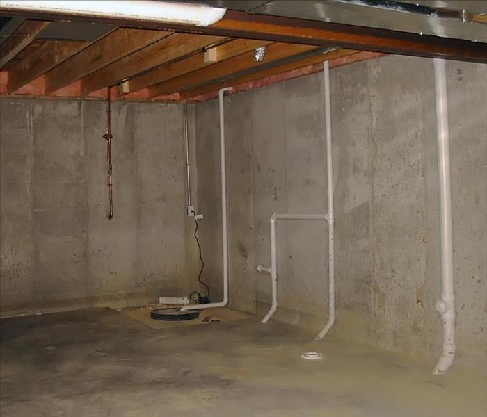 PVC plumbing and sump pump well, clean basement, not evidence of flooding