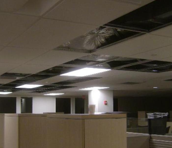 ceiling tiles removed, furnishings in office