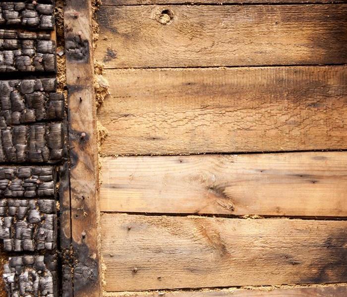 Fire damage to a wood wall. 