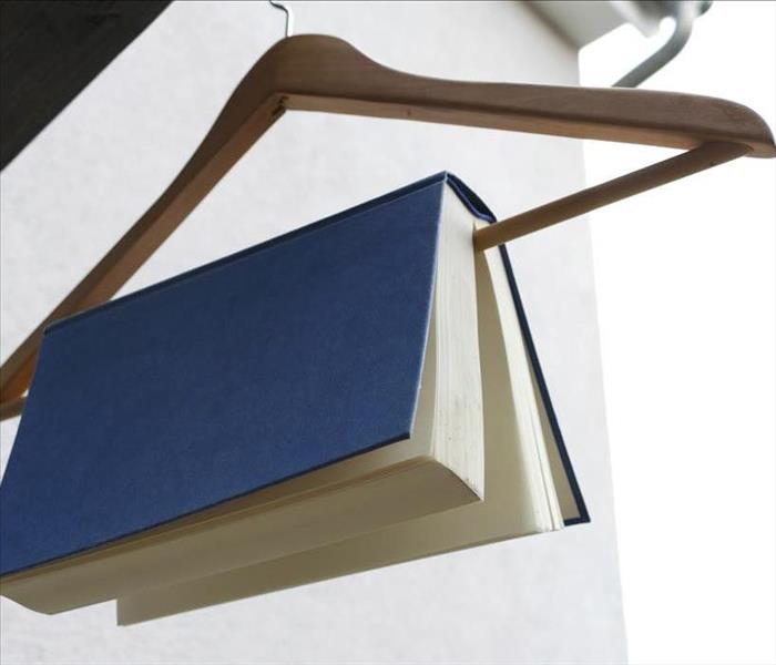 wet blue book on a hanger